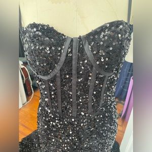 black sequence evening gown with train, corset style top with straps